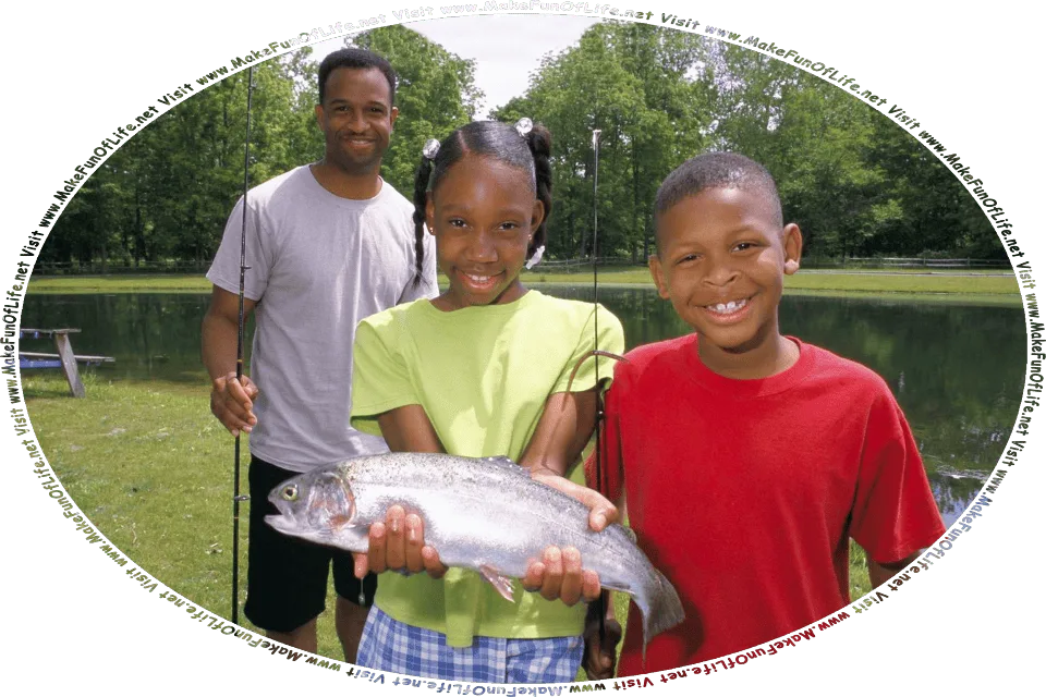 Picture of a happy smiling girl holding a fish, standing next to her happy smiling brother holding a fishing pole, with their happy smiling father standing just behind them holding a fishing pole, in green grass next to a lake, with green leafy trees on the far side of the lake, under an overcast sky, and the words, Visit www.MakeFunOfLife.net.