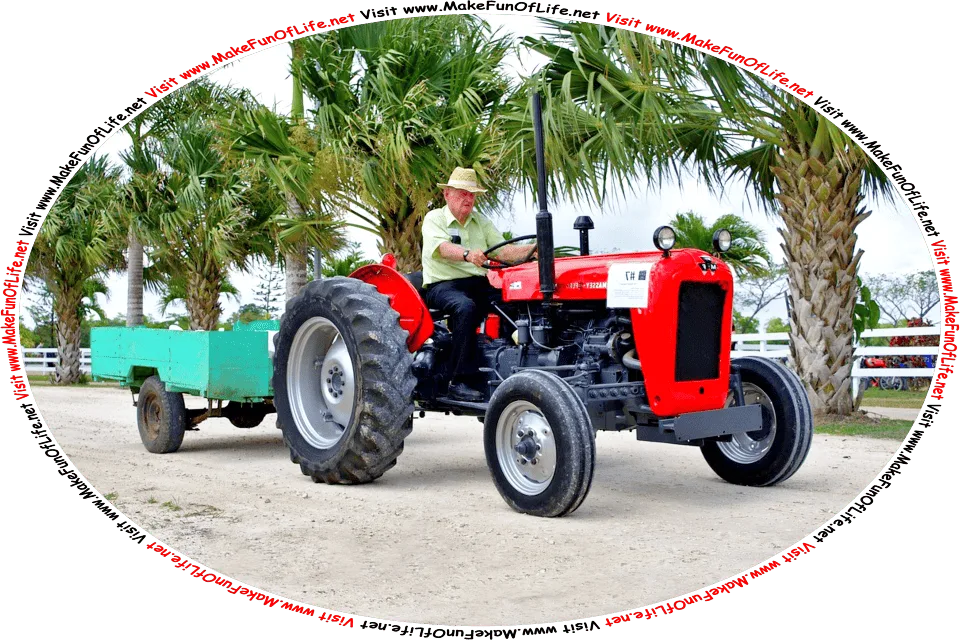 Picture of a man driving a tractor that is pulling a trailer on a road, and the words, Visit www.MakeFunOfLife.net.