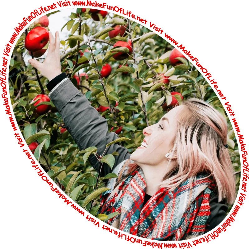 Picture of a happy smiling woman reaching upward to pick a red apple from an apple tree branch and the words, 'Visit www.MakeFunOfLife.net.'