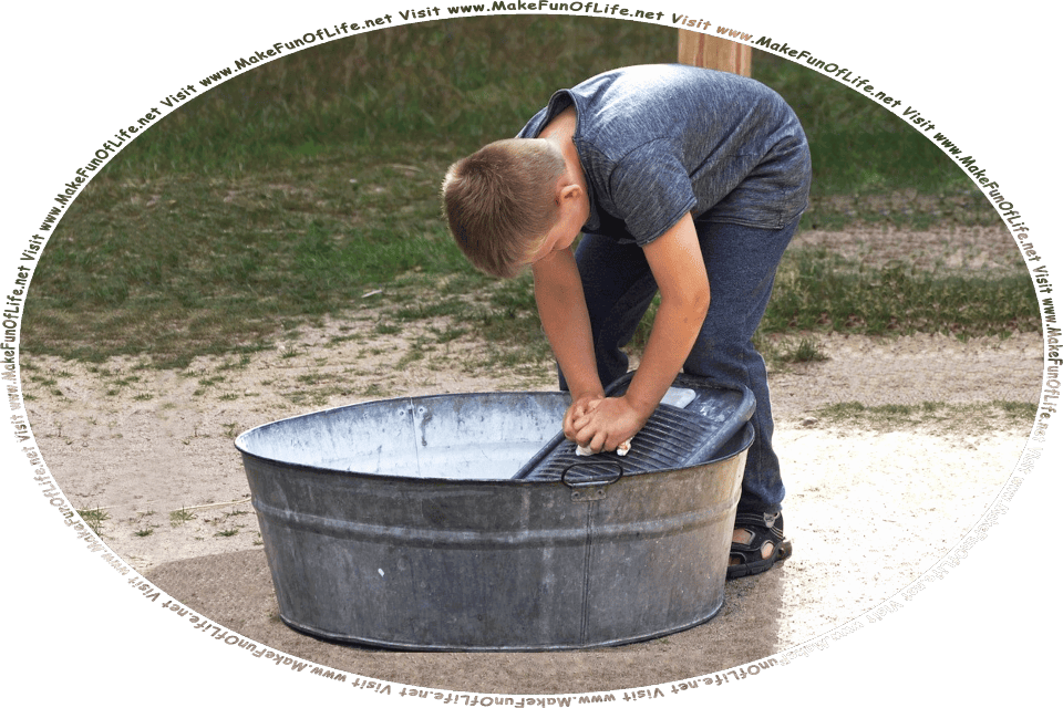 Picture of a boy at a washtub washing an article of clothing, and the words, Visit www.MakeFunOfLife.net.