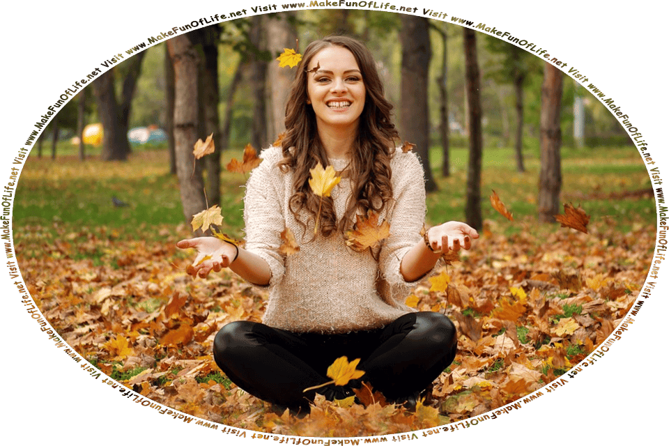 Picture of a happy smiling woman sitting cross-legged on the tree-leaf-covered green grassy ground of a park on an Autumn day, and the words, Visit www.MakeFunOfLife.net.