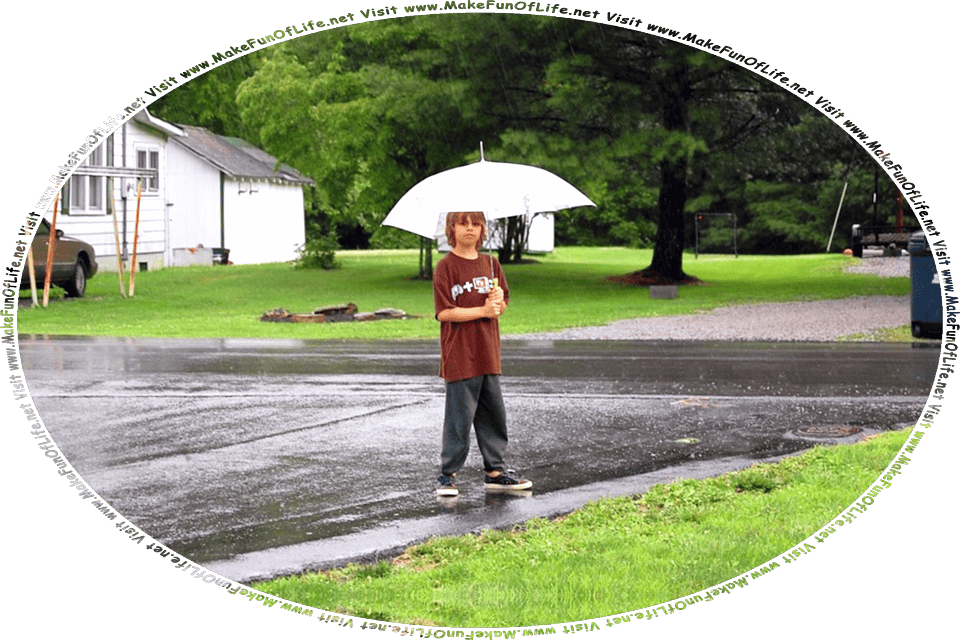 Picture of a boy holding an open umbrella above his head and standing outside of a house on a rainy day, surrounded by green grass and green leafy trees, and the words, Visit www.MakeFunOfLife.net.