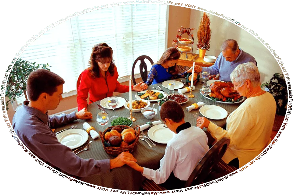 Picture of three generations of a family seated around a table and saying grace before a Thanksgiving Day dinner, and the words, Visit www.MakeFunOfLife.net.