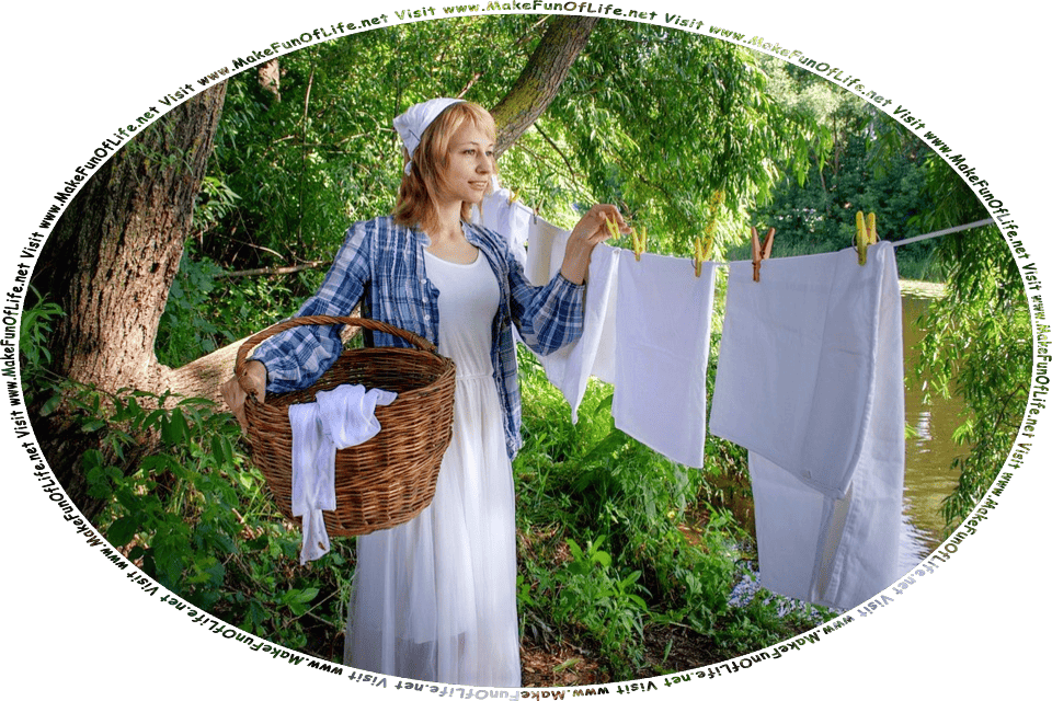 Picture of a woman standing under green leafy trees by a river, removing linens from a clothesline and placing them in a wicker basket, and the words, Visit www.MakeFunOfLife.net.