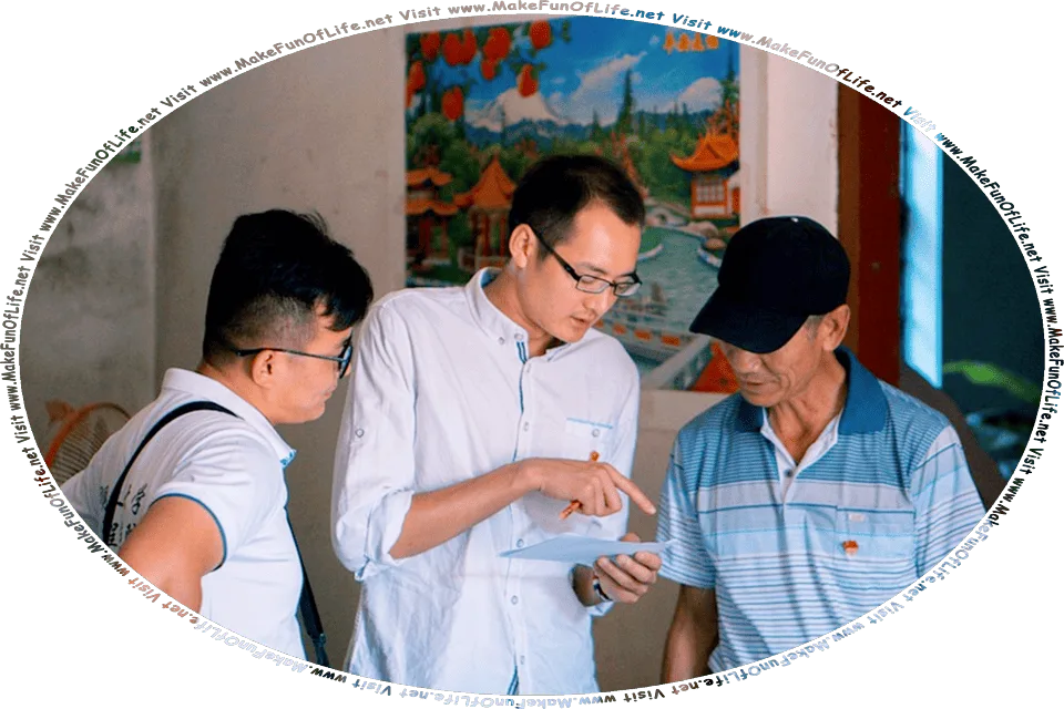 Picture of two men on either side of a third man, who is pointing with his finger at something on a piece of paper and holding a pencil, and the words, Visit www.MakeFunOfLife.net.