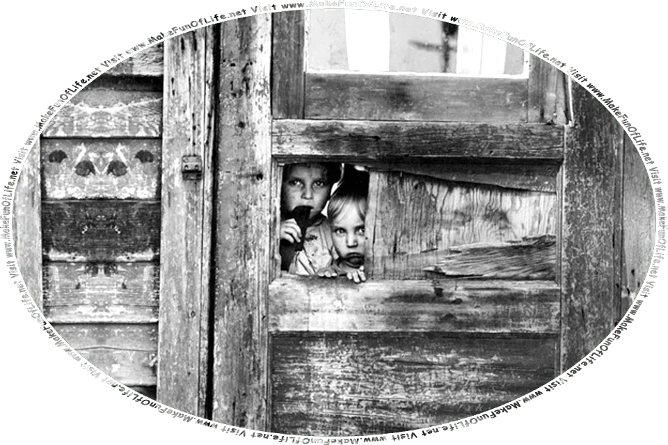 Picture of two boys peering out between some boards of a dilapidated old weather-beaten crudely-built wooden shack house, and the words, Visit www.MakeFunOfLife.net.