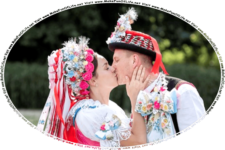 Picture of a man and a woman in festive costumes standing and kissing, and the words, Visit www.MakeFunOfLife.net.