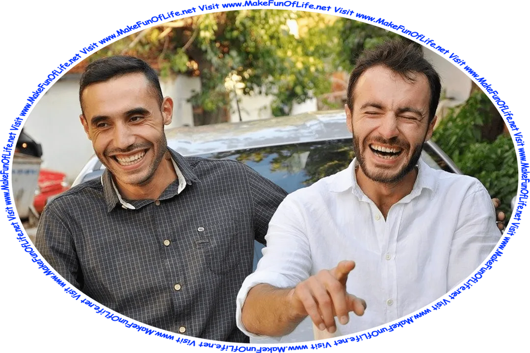 Picture of two happy smiling men laughing at a joke.