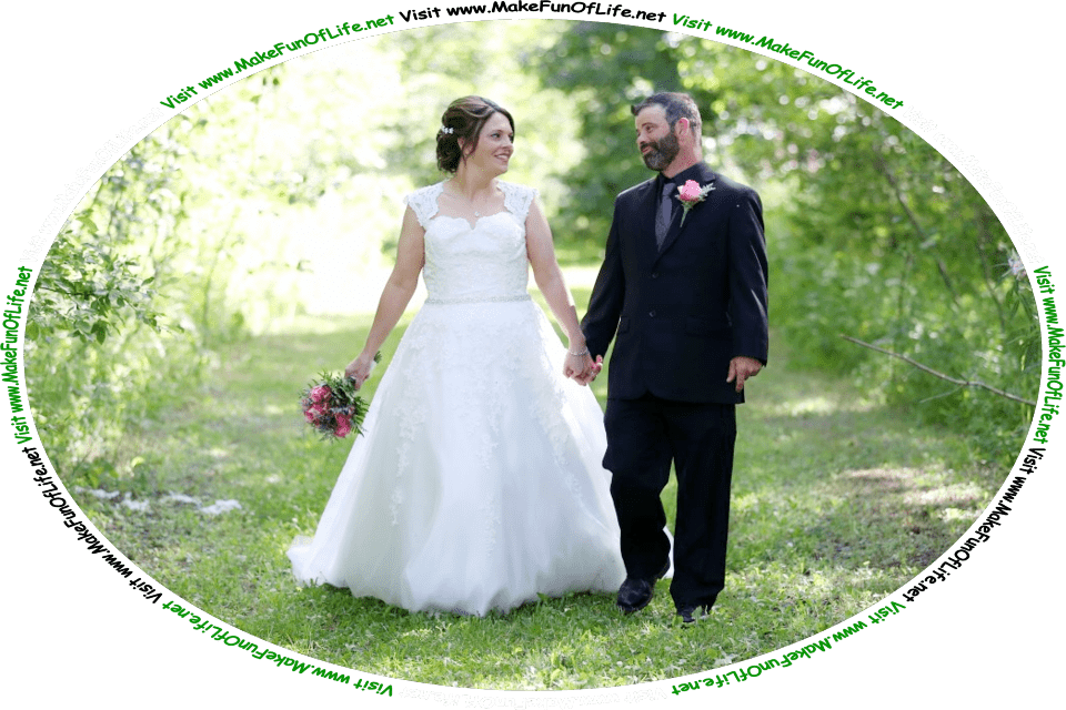 Picture of a happy smiling bride and a happy smiling groom walking hand-in-hand on a green grassy path through a woods of green leafy trees on a bright sunny day, and the words, ‘Visit www.MakeFunOfLife.net.’