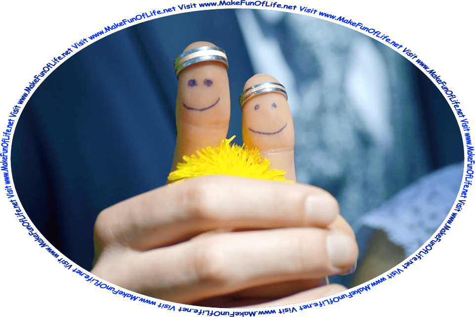 Picture of a bride and groom holding hands, with their thumbs pointing up, smiley faces drawn in blue ink pen on their thumbs, and the words, ‘Visit www.MakeFunOfLife.net.’