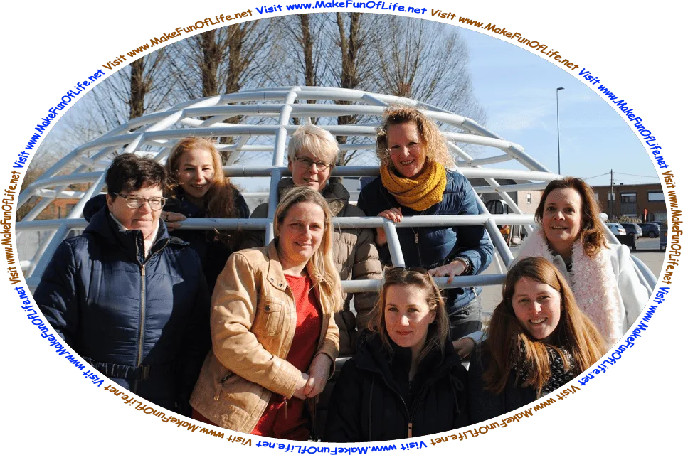 Picture of eight happy smiling women friends in a children’s playground on a winter day under a blue sky, and the words, ‘Visit www.MakeFunOfLife.net.’