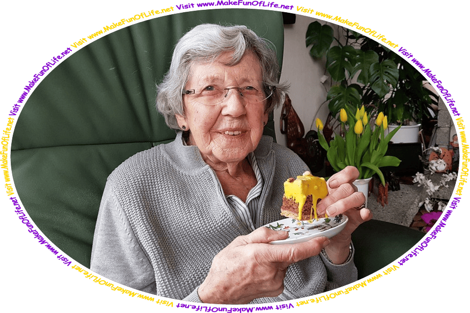 Picture of a happy smiling woman holding a plate with a piece of cake, and the words, ‘Visit www.MakeFunOfLife.net.’