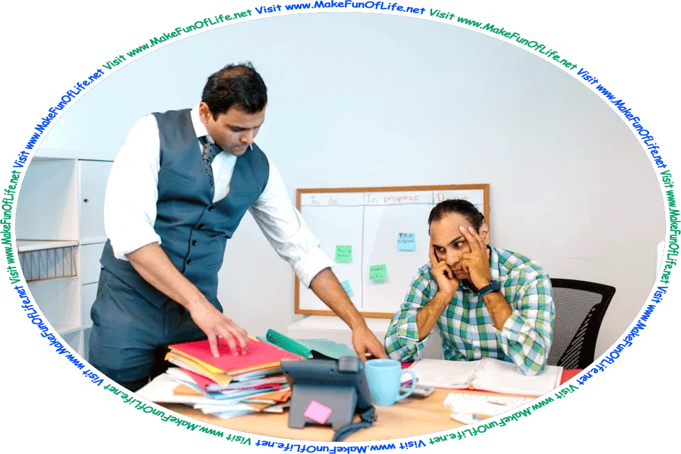 Picture of a man seated at a desk, being trained by his supervisor to do paperwork, and the words, ‘Visit www.MakeFunOfLife.net.’
