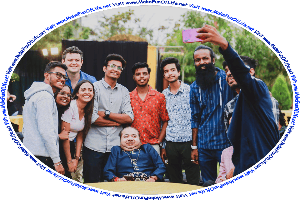 Picture of a group of happy smiling men and women having their picture taken by someone holding a cell phone camera, and the words, Visit www.MakeFunOfLife.net.