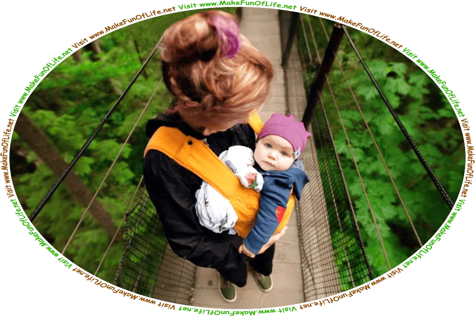 Picture of a woman holding a baby and standing on a footbridge in the tree canopy of a forest of green leafy trees, and the words, Visit www.MakeFunOfLife.net.