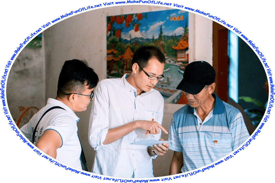 Picture of two men on either side of a third man, who is pointing with his finger at something on a piece of paper and holding a pencil, and the words, ‘Visit www.MakeFunOfLife.net.’