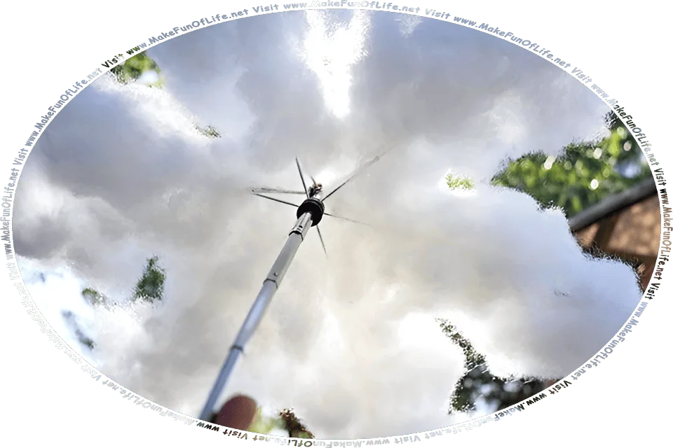 Picture of a cloud-like parasol made by attaching loose cotton over an old metal umbrella frame from which the cloth canopy is missing, Visit www.MakeFunOfLife.net.