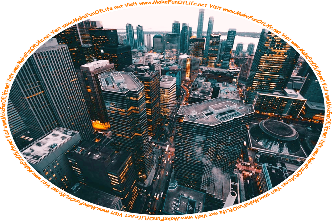 Picture of a city viewed from above, with densely packed skyscrapers and streets filled with vehicles, and the words, ‘Visit www.MakeFunOfLife.net.’