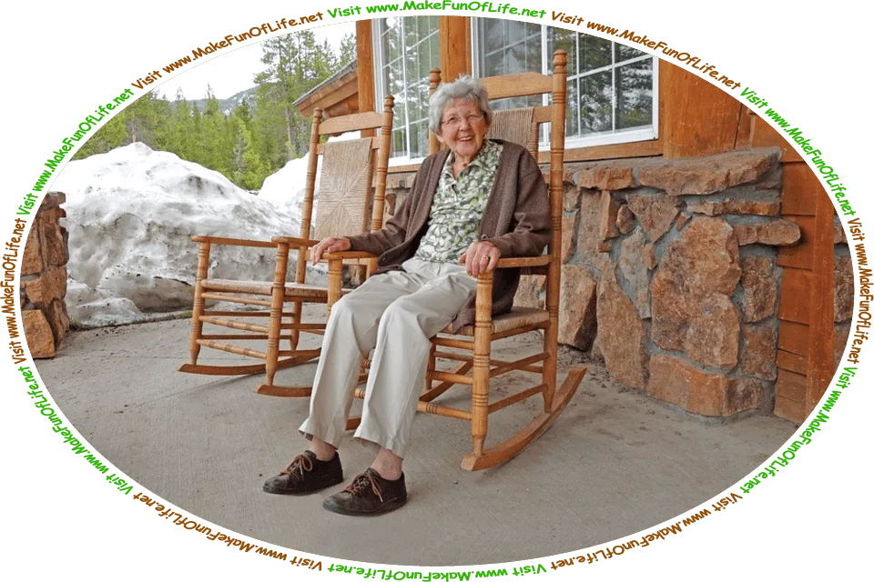 Picture of a happy smiling elderly woman sitting in a rocking chair outside on the front porch of a building on a winter day, and the words, ‘Visit www.MakeFunOfLife.net.’