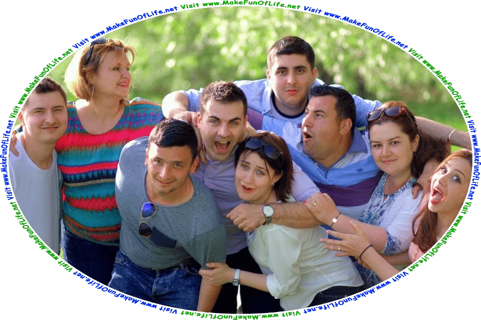 Picture of a group of smiling happy friendly men and women standing in green grass with green leafy trees in the background, and the words, ‘Visit www.MakeFunOfLife.net.’