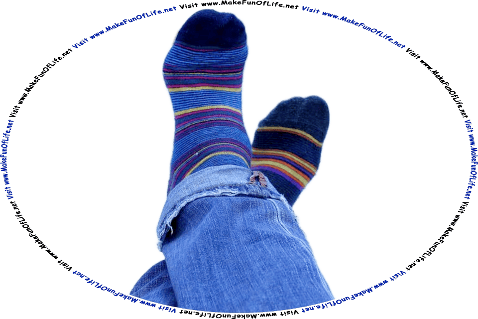 Picture of a person’s shoeless feet propped up on a table, while wearing dark blue socks with thin red, yellow, and light blue stripes, and the words, Visit www.MakeFunOfLife.net.